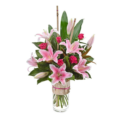 Large Bouquet of Oriental Lilies & Roses in a Glass Vase

Elegant, modern and delivered in a glass vase, this vibrant bouquet of pink oriental lilies and roses, lush foliage, and bamboo is ideal for an impressive gift or corporate arrangement. Send your best wishes with the stunning Allegra.

Flowers may vary from the image displayed due to seasonal availability. We'll craft an arrangement which is similar in style using seasonal flowers that is equal or greater in value. 
