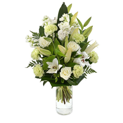 Large Bouquet in a Glass Vase

Vibrant white lilies, cream coloured roses, and soft green carnations are displayed amongst tall green foliage in this premium arrangement. Standing tall in a glass vase, Cloud will be loved for its modern presentation and stylish appearance.

Flowers may vary from the image displayed due to seasonal availability. We'll craft an arrangement which is similar in style using seasonal flowers that is equal or greater in value. 