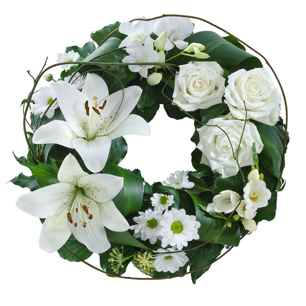 Mixed White Floral Wreath

This floral wreath features beautiful blooms in tasteful white with lush green foliage. Suitable for delivery to service only (not suitable for delivery to home).

Flowers may vary from the image displayed due to seasonal availability. We'll craft an arrangement which is similar in style using seasonal flowers that is equal or greater in value. 