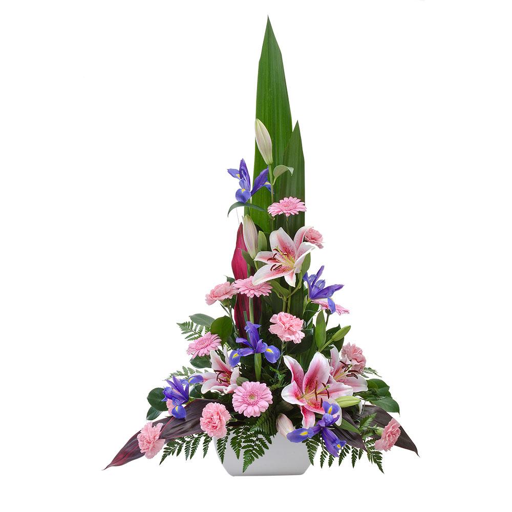 Large Mixed Arrangement in a Ceramic Container

Executive is sure to impress with its size and beauty. Stunning pink and purple blooms are presented amongst green and purple tinged foliage. Expertly handcrafted and standing tall, this arrangement is truly arresting.

Flowers may vary from the image displayed due to seasonal availability. We'll craft an arrangement which is similar in style using seasonal flowers that is equal or greater in value. 