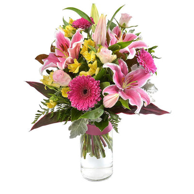 Large Bright Bouquet in a Glass Vase

True to its namesake, Opulent, this large bouquet is an astounding sight. A bright combination of pink and yellow in lilies, roses, gerberas, and alstroemeria, highlighted by green and purple foliage. Standing tall in a glass vase, this gift will amaze them.

Flowers may vary from the image displayed due to seasonal availability. We'll craft an arrangement which is similar in style using seasonal flowers that is equal or greater in value. 