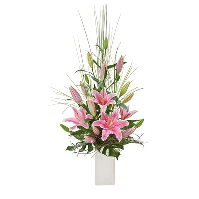 Elegant Arrangement of Oriental Lilies

This striking arrangement features beautiful pink oriental lilies, standing tall in a ceramic vase. Highlighting by lush foliage, this arrangement is ideal for celebrating a birthday or milestone. Make their day with Panache.

Flowers may vary from the image displayed due to seasonal availability. We'll craft an arrangement which is similar in style using seasonal flowers that is equal or greater in value. 