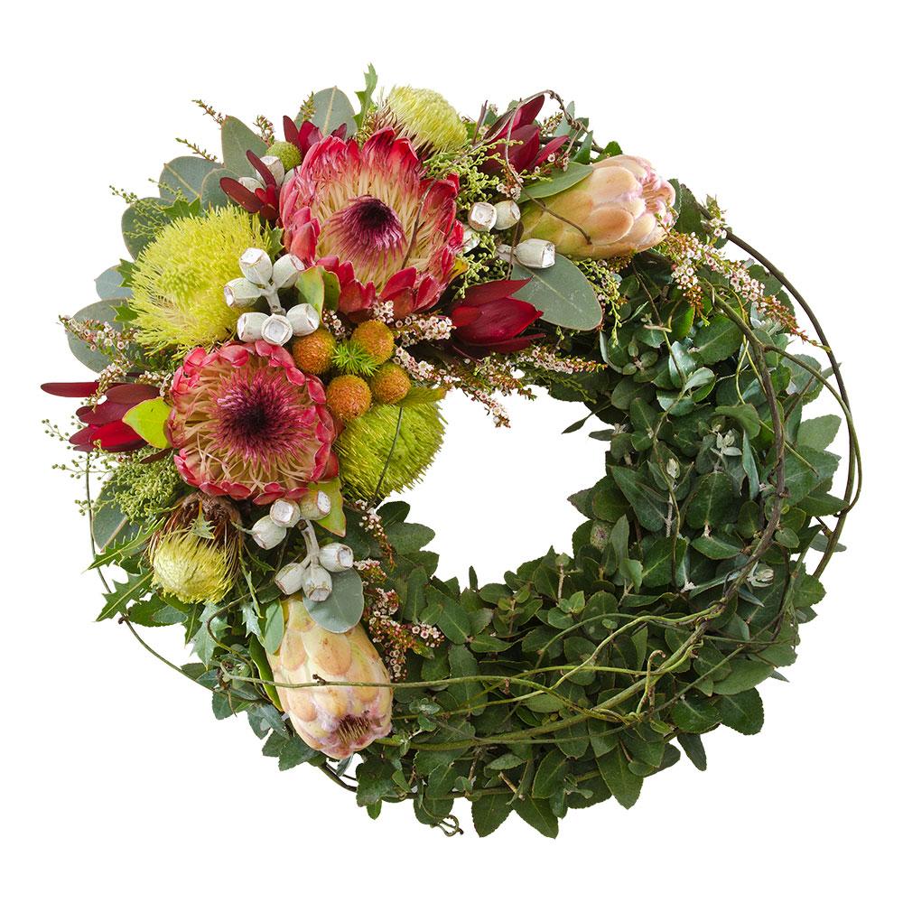 Floral Wreath of Wildflowers

This wreath of wildflowers features Australiana themed blooms and traditional laurel leaves. Suitable for delivery to service only (not suitable for delivery to home).

Flowers may vary from the image displayed due to seasonal availability. We'll craft an arrangement which is similar in style using seasonal flowers that is equal or greater in value. 
